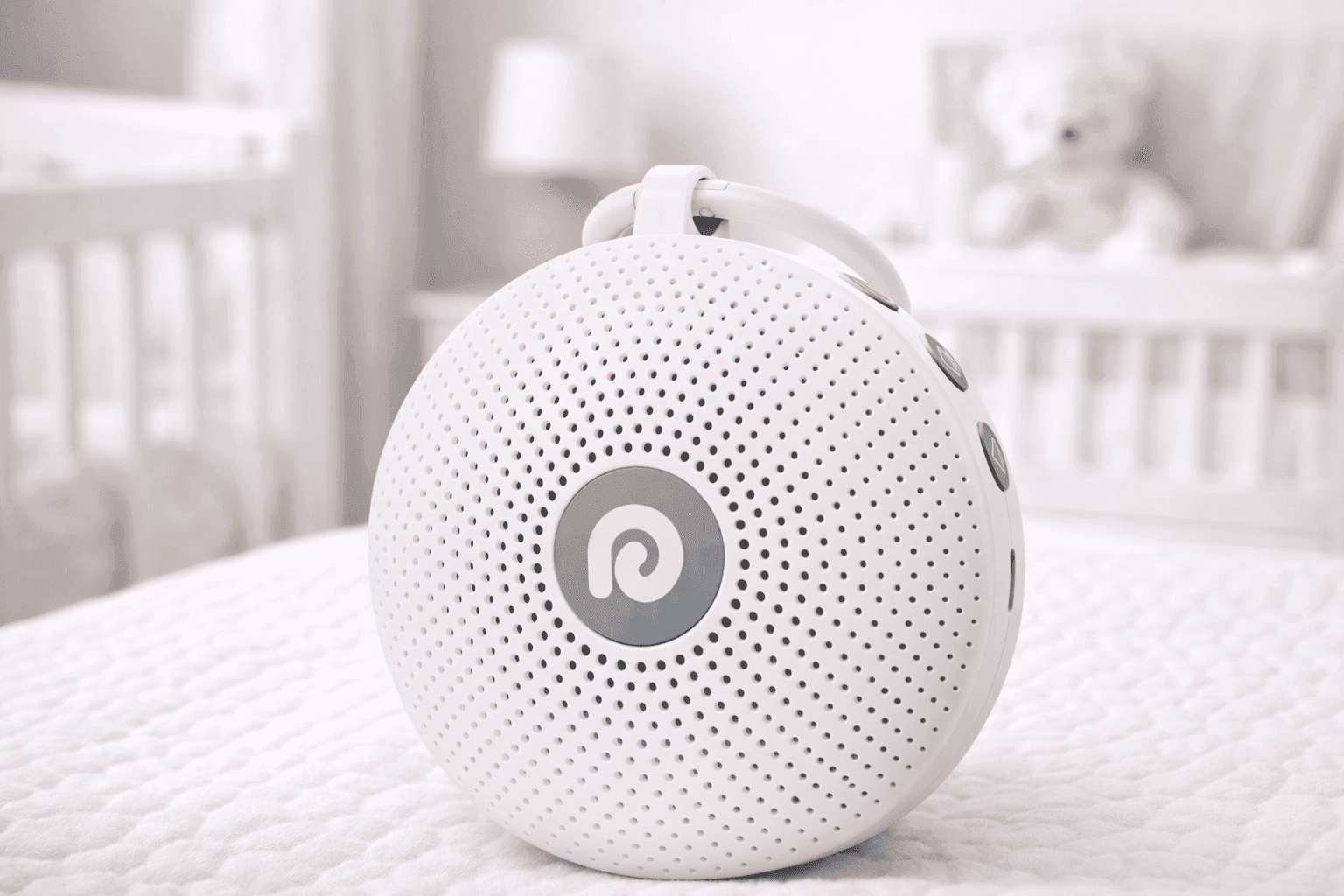 Dreamegg Portable Noise Machine on bedside table for better sleep and noise masking
