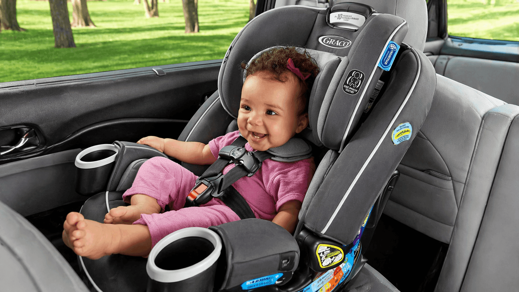 Graco 4Ever DLX 4-in-1 car seat installed rear-facing in family vehicle interior